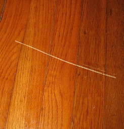 Wood floor scratch remover
